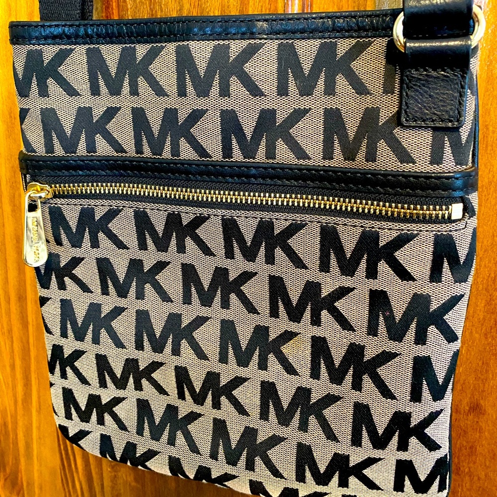 SOLD Michael Kors crossbody.  Black and gray canvas with gold hardware.